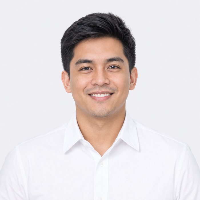 Smiling young man in a white shirt